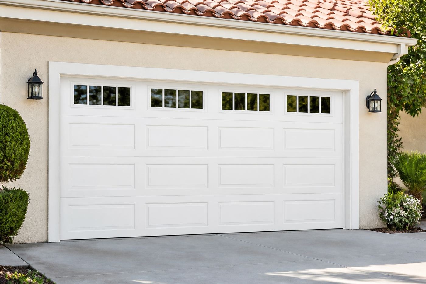 Exterior view of a finished white raised-panel garage door