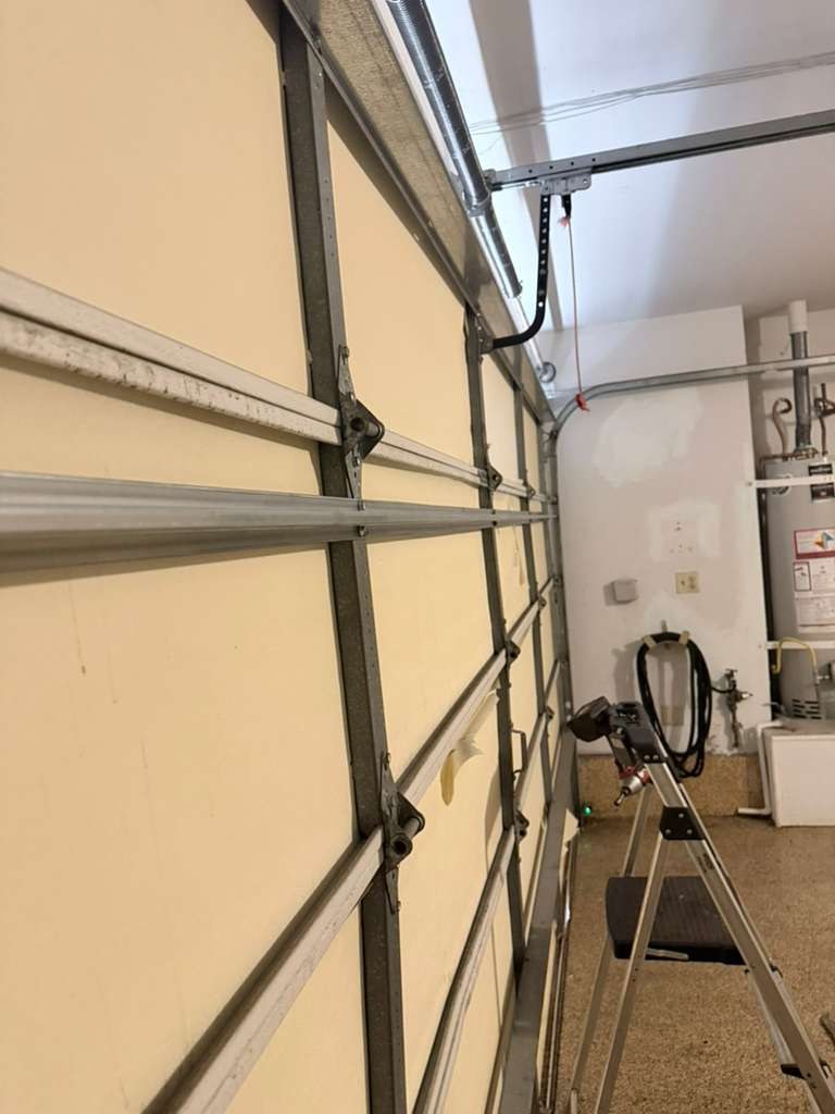 Garage door tracks and hinges inside a garage