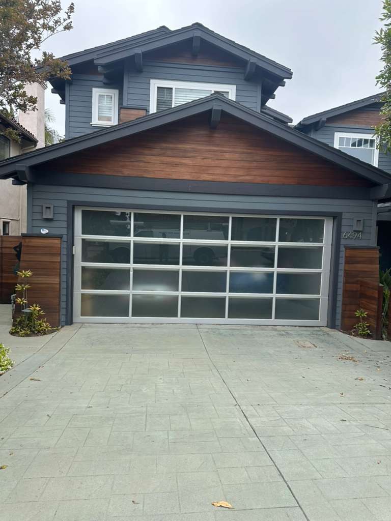 A modern frosted glass garage door installed by Angel Garage Door